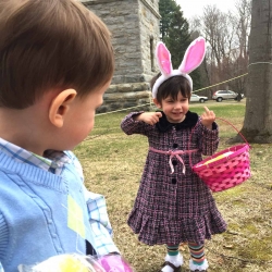 A young girl shows off her Easter egg basket