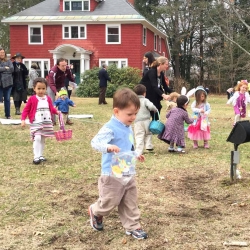 Children search the green of the First Congregational Church of Stockbridge for Easter eggs