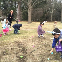 Children search the green of the First Congregational Church of Stockbridge for Easter eggs