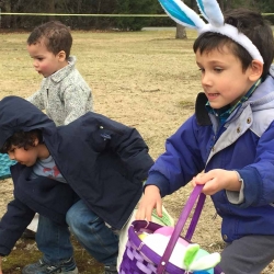 Three boys scamper for Easter eggs at the First Congregational Church of Stockbridge