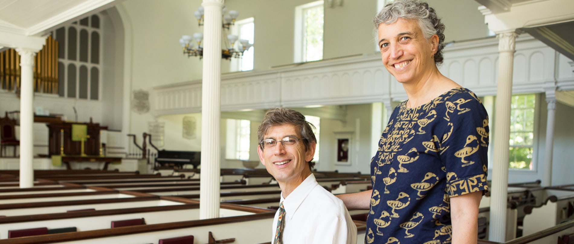 A husband and wife in the sanctuary of the Stockbridge Congregational Church
