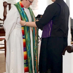Rev. Patty Fox receives a clerical stole from a congregant