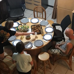 People gather around the dinner table