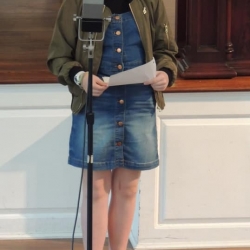 A preteen girl plays a part in the radio play