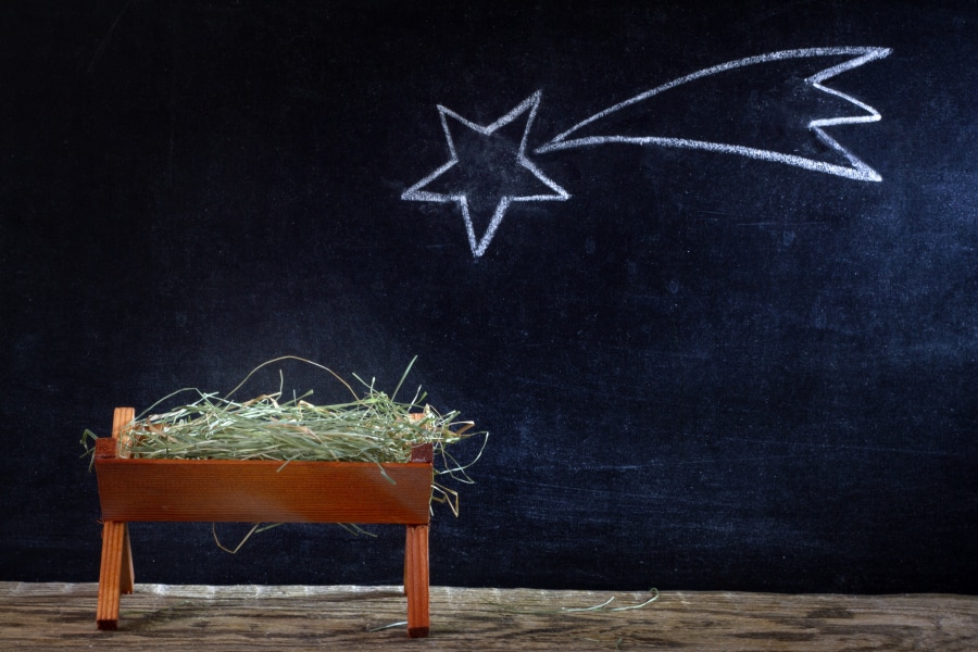A manger and star on blackboard.