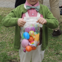 A boy shows off his Easter eggs