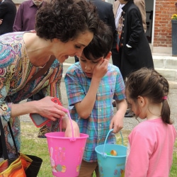 A mother looks at the Easter Eggs her kids have found