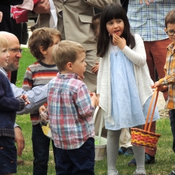 Children gather on the lawn after the concultion of the Easter egg hunt