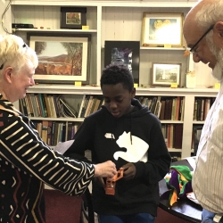 A boy receives a donation for UNICEF