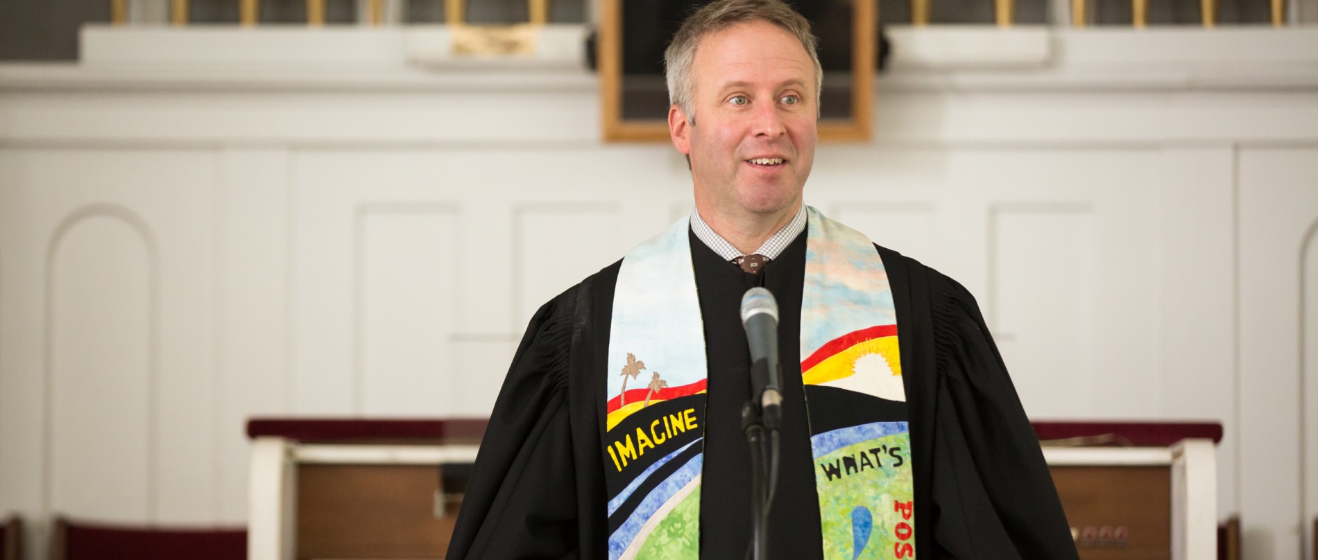 Rev. Brent Damrow preaching from the pulpit