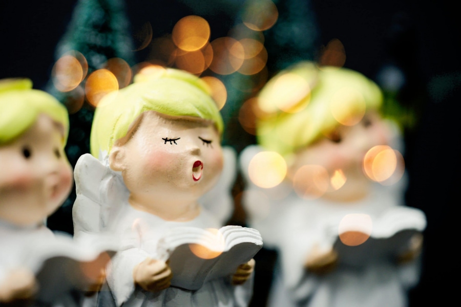 A clay figurine sings Christmas carols