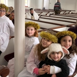 A group of children dressed as angels and sheep