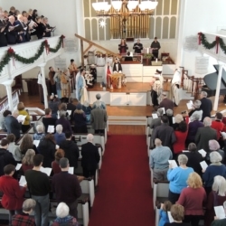 The congregation stands and sings The First Nowell