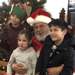 Santa Claus surrounded by children