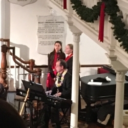 Pianist Joe Rose accompanies a duet between two young women