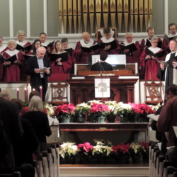 The choir sings a Christmas anthem