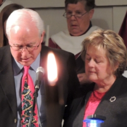 A middle-aged couple reads various texts from the Bible on the theme of light.